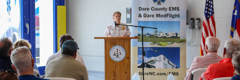 Image of Dare County EMS chaplain Cherri Wheeler speaking at a podium.