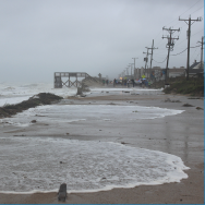 Image of the ocean washing over NC Hwy. 12 in Kitty Hawk.