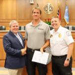 Image of Matthew Stankavich accepting his certificate.