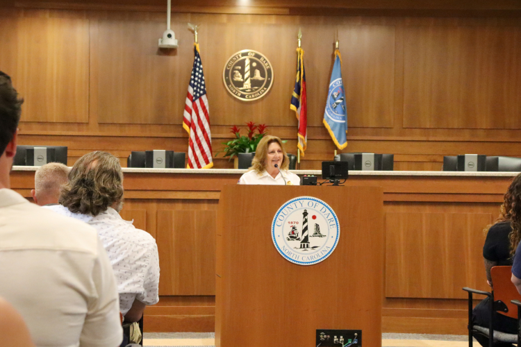 Image of Chief Jennie Collins speaking at the podium.