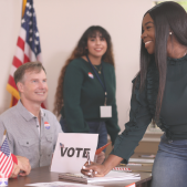 Image of people registering to vote.