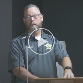 Image of Captain Kevin Duprey speaking at a podium