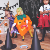 Kids in costumes at a halloween party.