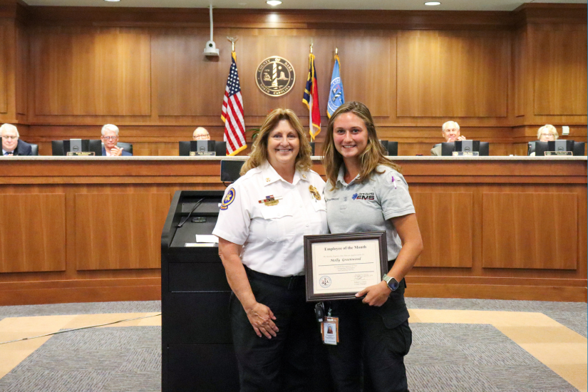 Image of Dare County EMS Director Chief Jennie Collins (left) presenting the certificate to Molly Greenwood (right).