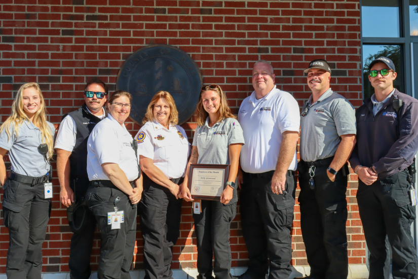 Image of Molly Greenwood standing with her Dare County EMS colleagues.