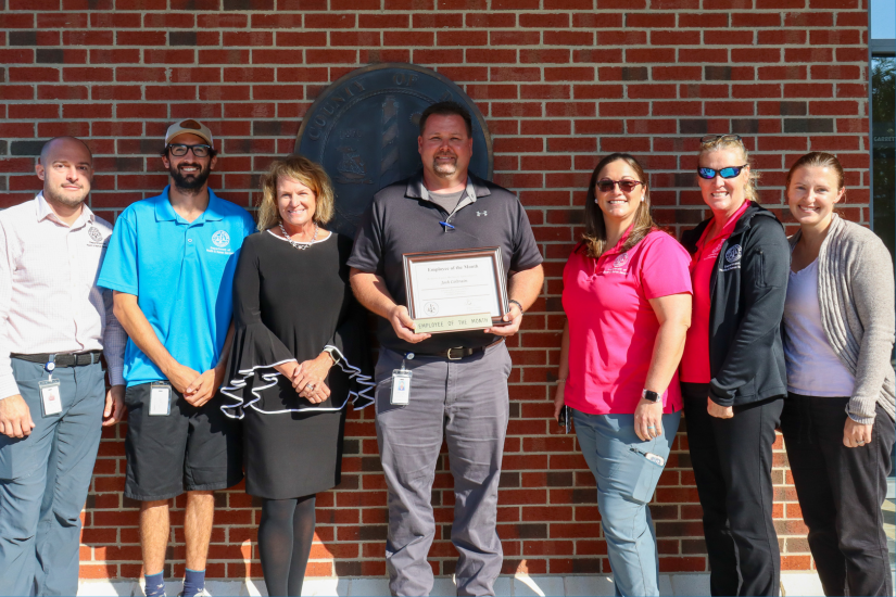 Image: Joshua Coltrain stands with his Department of Health & Human Services colleagues.