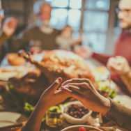 Image of a family praying over a Thanksgiving meal