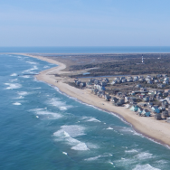 Aerial image of the Buxton coastline, featuring the FUDS and the Cape Hatteras Lighthouse.