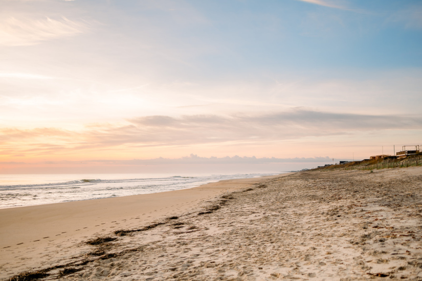 Image of an empty beach at sunrise.