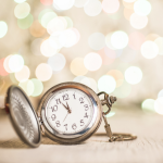Image of a pocket watch that is about to strike 12 a.m. on New Year's Day.