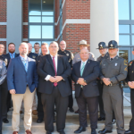 Image of a group of Sheriff's deputies standing together on building steps.