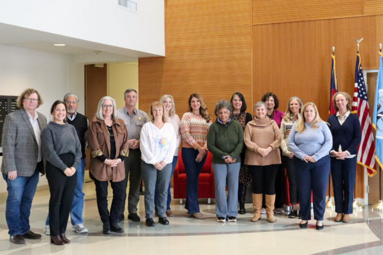 Image of 15 of the Dare A250 Committee members standing together.