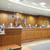 Image of the Dare County Board of Commissioners in the meeting room.