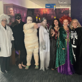 Image of librarians dressed up in spooky costumes for library Halloween events in October 2024.