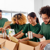 Image of volunteers packing food items at a food pantry.