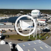 Image of Wanchese Harbor. A play button over the video signifies that a video will play when clicked.