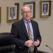 Image of County Manager Bobby Outten speaking.