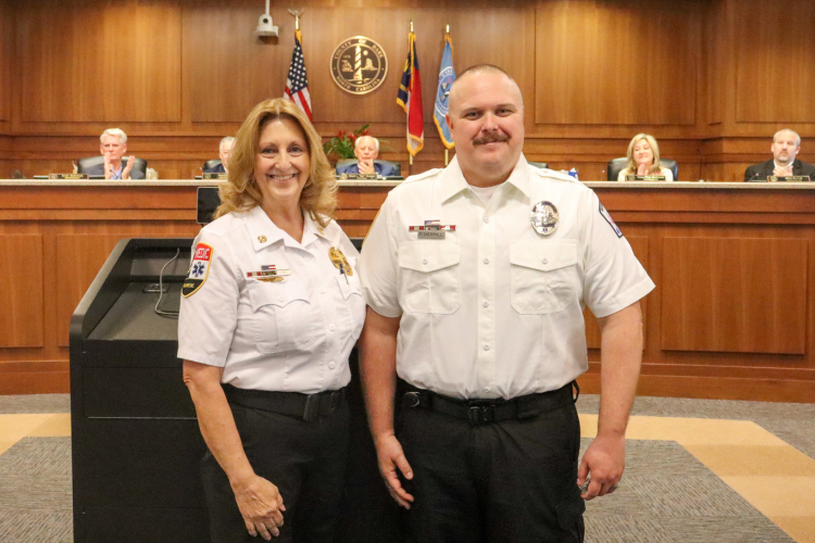 Phillip Merrill, Emergency Medical Technician for Dare County EMS receives 15-year pin from Dare County EMS Director Chief Jennie Collins