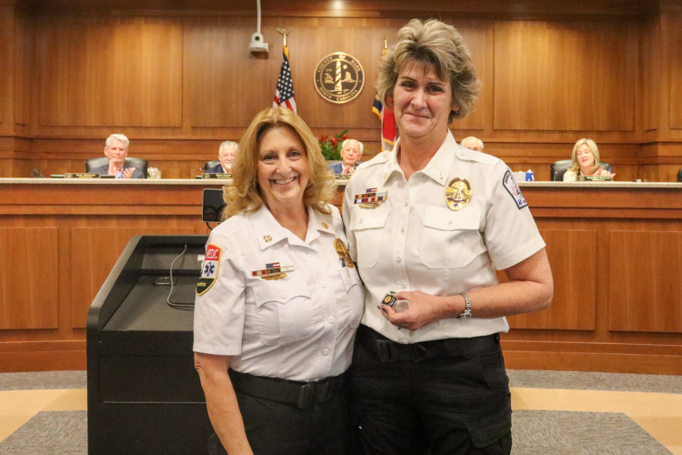 Jeanna Salter, Lieutenant for Dare County EMS receives 10-year pin from Dare County EMS Director Chief Jennie Collins.