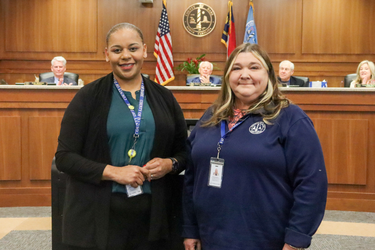 Paula Rodriguez, Income Maintenance Supervisor receives 15-year pin from Income Maintenance Supervisor Stephany Wrighton.