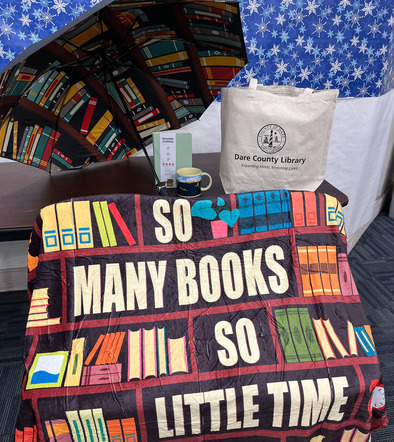 Book lovers prize package with blanket, mug, umbrella, journal and tote bag
