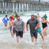 Image of last year's plungers emerging from a cold ocean.