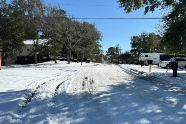 Image of a snow and ice covered Colington Drive.