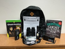 Contents of Ghost Hunting Kit include backpack, tools, flashlights, books.