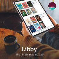 Libby the library reading app hands holding a tablet with ebooks on the Libby app