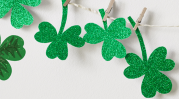 Shamrocks clothespinned onto a string