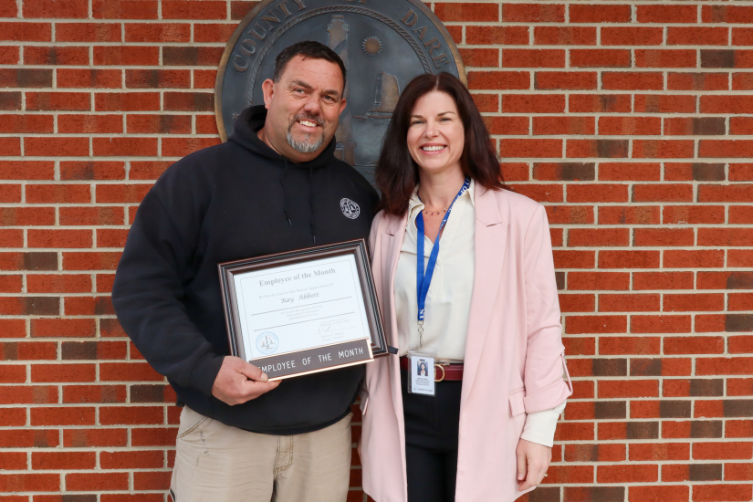 Image of Public Utility Director Jessica King presenting the award to Plant Maintenance Mechanic Ray Abbott.