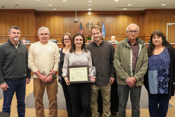 Skyler Foley stands with her family members who surprised her by attending the presentation.