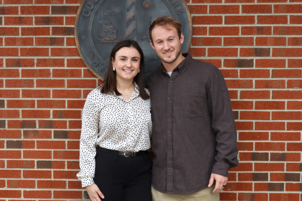 Skyler Foley stands with her husband who surprised her by attending the presentation.