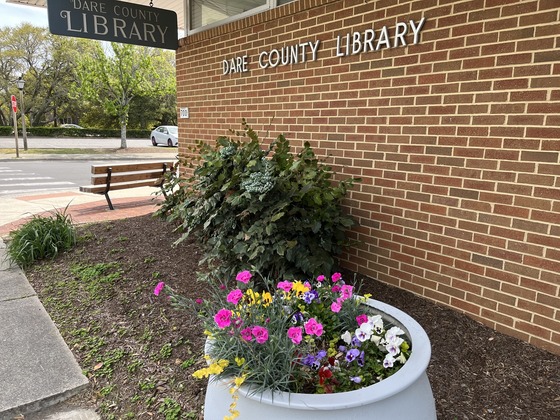 Manteo Library with spring flowers blooming outside