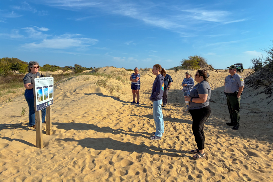 Image of a ranger sharing information with a group of teachers.