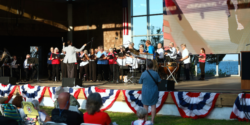 Image of the Community Choir patriotic performance during the Dare A250 Faire: Star Spangled Spectacular 