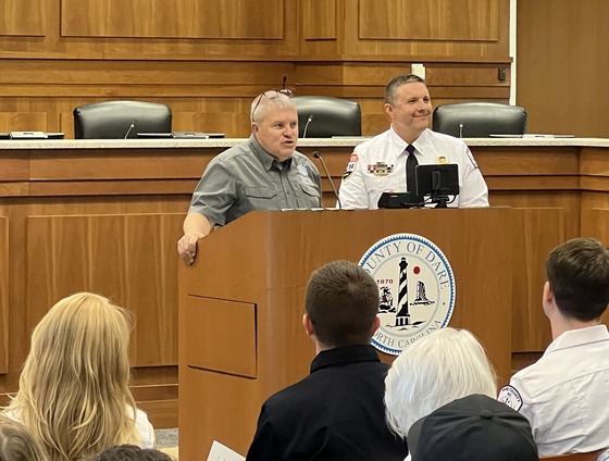 Image of COA EMS Program Coordinator Walter Meads and Dare County EMS Instructor Lieutenant Joshua McKenney awarding the students