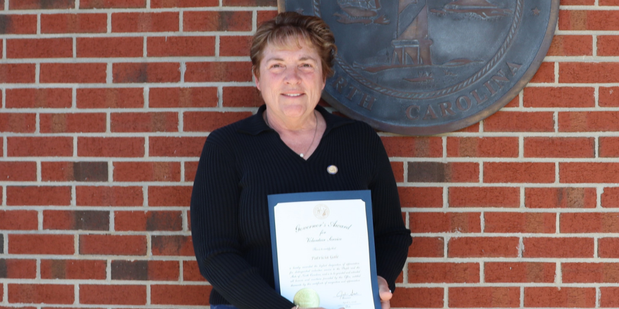 Image of Patricia Gale holding her award