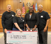 Garage Band Charities founders present a $8,000 check to the Virginia Tillett Endowment Fund at Elizabeth City State University