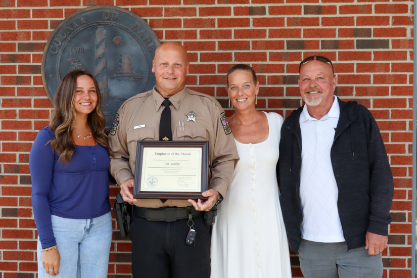 Deputy Gump stands with his family members who attended the presentation.