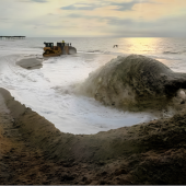 Image of beach nourishment sand pumping in Avon.
