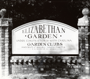 Image of a stone sign for Elizabethan Garden that says "Under construction by NC Garden Clubs Innocenti & Webel Architects"