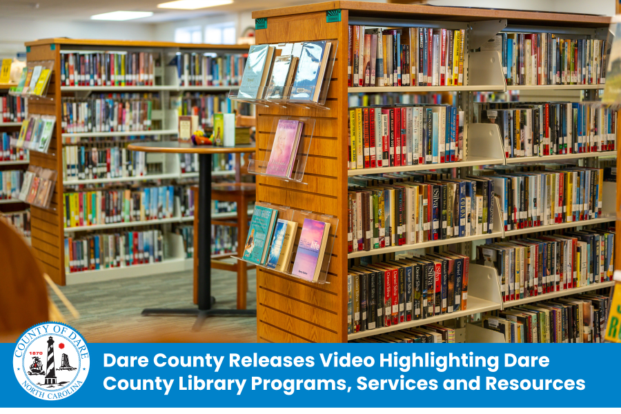 Image of rows of bookshelves at Manteo library. Heading: Dare County Releases Video Highlighting Dare County Library Programs, Services and Resources