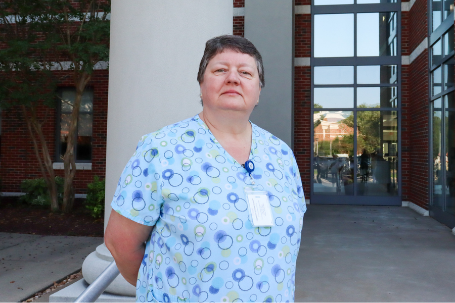 Image of Pam Kaiser wearing a nursing shirt and badge.