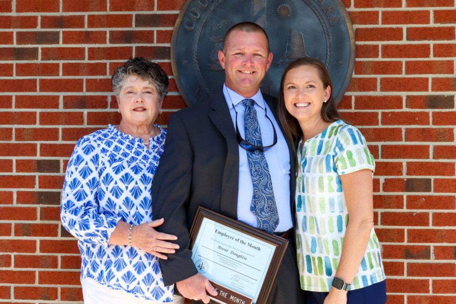 Brent Doughtie stands with family members who attended the presentation.