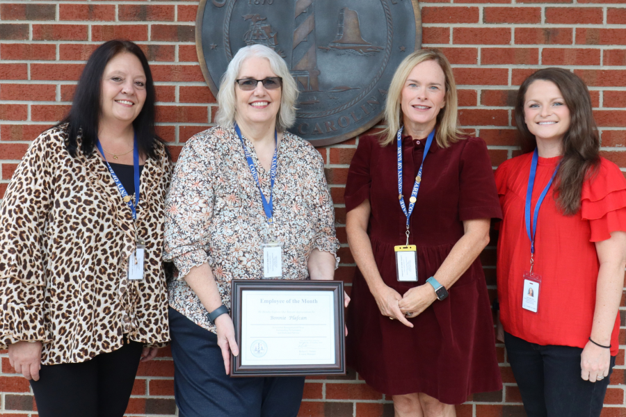 Bonnie Plafcan stands with her Dare County Human Resources colleagues, who attended the presentation.