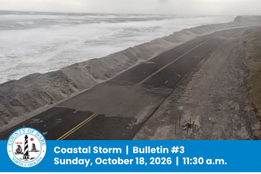 Aerial image of sand-covered NC Hwy. 12 along the ocean. Heading: Coastal Storm  |  Bulletin #3 Sunday, October 18, 2026  |  11:30 a.m.