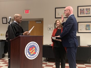Greg West takes oath of office.