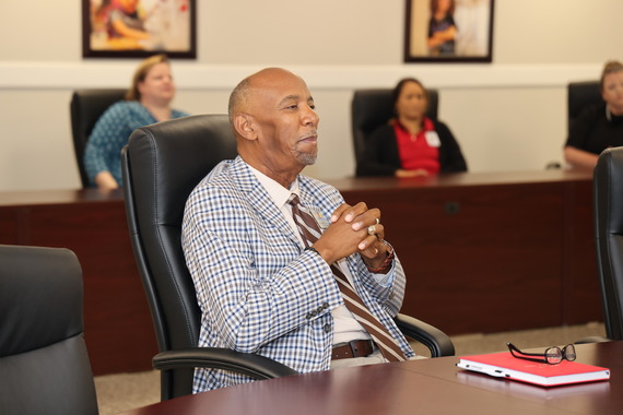 Dr. Connelly Listening to Kind Words during Reception