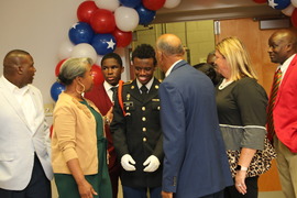 Veterans talking to JROTC Cadet